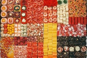 Colorful assortment of cured meats, cheeses, and sweets photo
