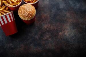 Fast food meal with fries, burger, and sides photo