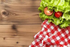 Fresh salad ingredients on a wooden table photo