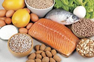Fish, nuts, eggs, almonds, and other foods photo