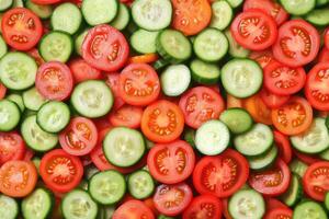 Sliced Cucumbers and Tomatoes photo
