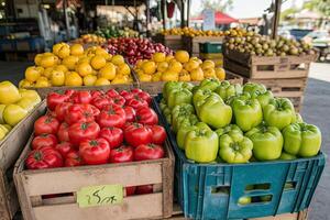 Fresh produce in wooden crates at a market photo