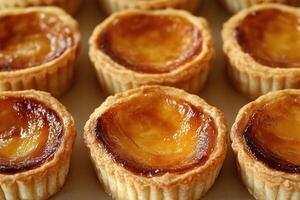 Miniature tarts with golden custard filling photo