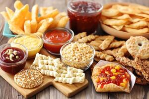 Assorted snack foods with dips and sauces photo