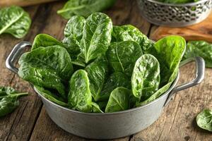 Fresh spinach leaves in a colander photo