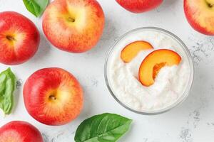 Fresh yogurt parfait with peaches and apples photo