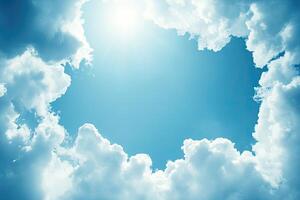 A bright sky framed by puffy clouds photo