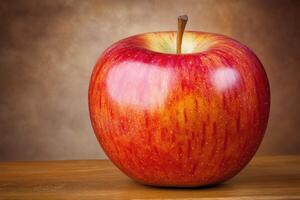Red apple on a wooden surface photo