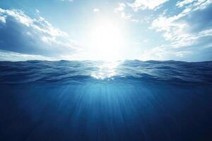 Ocean water with sun shining through it photo