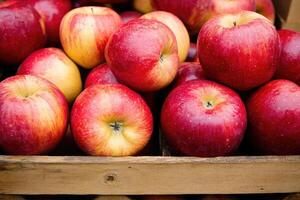 Fresh apples in wooden crate photo
