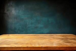 Empty wooden table against teal wall photo