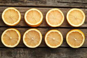 Citrus slices on rustic wood photo