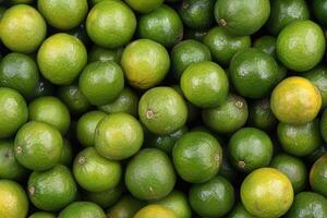 Fresh green limes densely packed photo