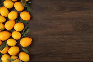 Fresh lemons arranged on a dark wooden surface photo
