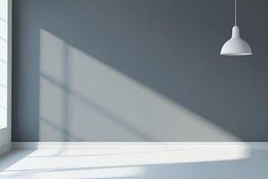 Empty room with muted gray walls, white floor, and pendant light. Sunlight casts shadows photo