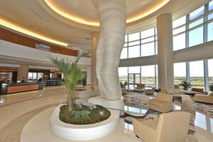Modern hotel lobby with curved wall and panoramic views photo