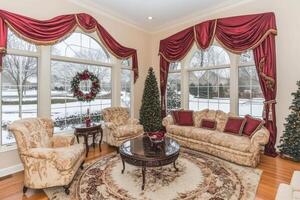 Cozy winter living room with snowy view photo