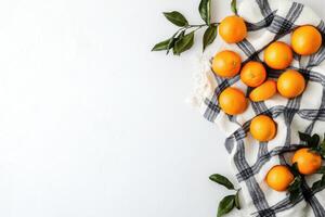 Fresh oranges on a checkered cloth photo