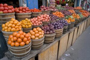 Colorful display of fresh produce in wooden tubs photo