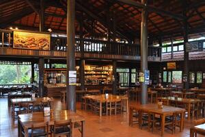 Rustic, open-plan dining hall with wooden accents photo