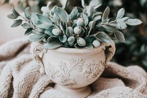 Elegant, muted pastel tones, decorative bowl with greenery and berries photo