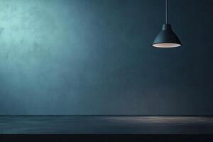 Empty room with moody teal wall and hanging lamp photo