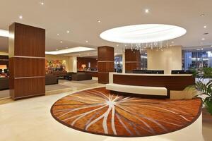 Modern hotel lobby with reception desk photo