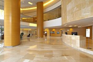Modern, spacious lobby with warm tones photo