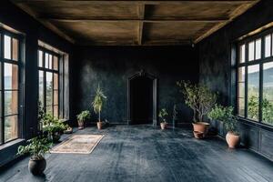Empty room with dark walls, large windows, and potted plants photo