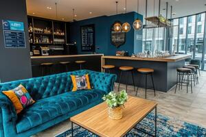 Modern, stylish bar area with teal accents photo
