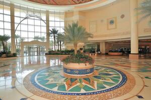 Grand hotel lobby with circular tiled floor design photo