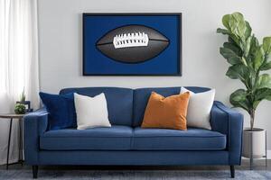 Modern living room featuring a navy blue sofa with accent pillows and a framed football print photo