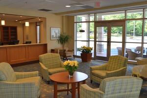 Bright, inviting lobby with comfortable seating and outdoor views photo