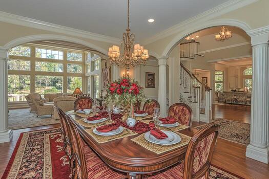 Spacious dining room with large windows and archways photo