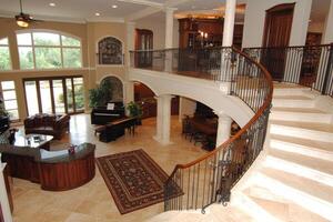 Grand Two-Story Foyer with Spiral Staircase photo