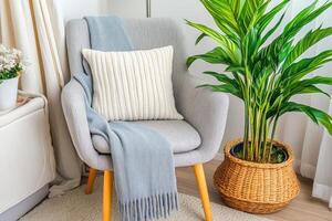Cozy corner armchair with throw blanket and pillow photo