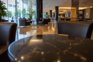 Modern hotel lobby with comfortable seating and polished floors photo