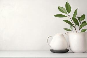 Simple, minimalist, ceramic pitcher and mug. Fresh green leaves photo