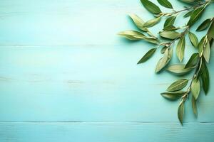 Fresh, vibrant greenery on light teal wooden surface photo
