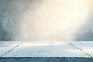 Empty light-washed wooden table against a blurred gray concrete wall photo