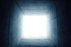 Concrete tunnel opening to bright light photo