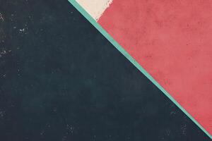 Abstract painted concrete. Two contrasting colors, dark navy and dusty rose, meet in a diagonal stripe photo