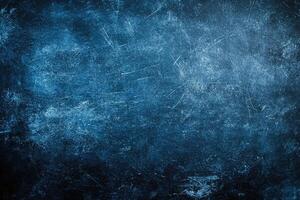 Dark blue textured surface with scratches and marks photo