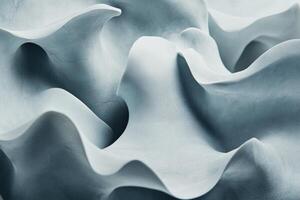 Abstract, sculpted, light-gray, flowing forms photo
