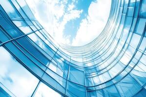 Modern glass facade building reaching for sky photo