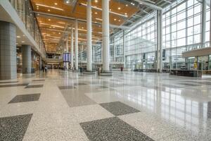 Spacious airport terminal interior with polished floors, modern architecture, and natural light photo