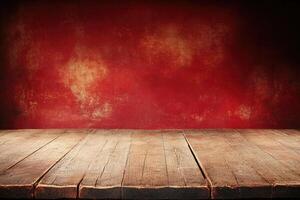 Rustic wooden tabletop against a deep red textured wall photo