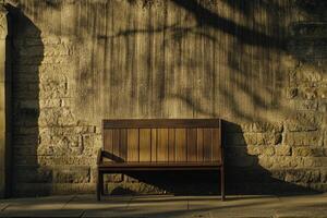 Simple wooden park bench against a weathered stone wall photo