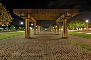 Concrete walkway at night photo