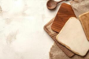 Wooden kitchen utensils on a textured surface photo